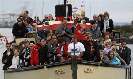 People gather on a boat in Belfast Lough, Northern Ireland, on Tuesday,&nbsp;to a attend a religious service at the exact spot were the Tittanic was launched 100 years ago. Among the guests invited were local school children and descendants of people who worked on the ship. The ship entered Belfast Lough on 31 May 1911 from Harland & Wolff, then the largest shipyard in the world. 
